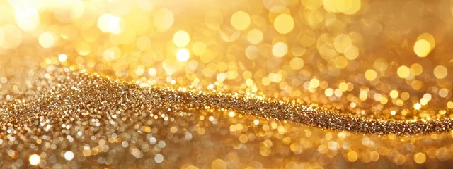 Foto op Canvas glossy golden sand with glittering details blurred bokeh background © MSTSANTA
