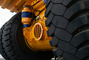 Tires close up. A huge wheel with a tire of a dump truck close-up. Truck tires close up. Giant...