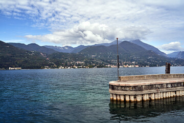 concrete pier and mountains on Lake Garda