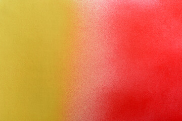 yellow and red color spray paint gradient on white color paper