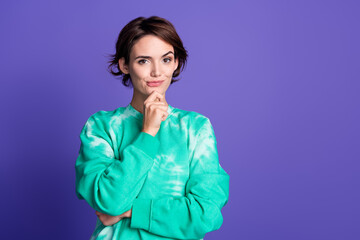 Photo portrait of attractive young woman touch chin thoughtful dressed stylish green clothes isolated on violet color background - obrazy, fototapety, plakaty