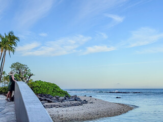 SUNWORSHIPPER WATCHES SUNRISE FROM BRIDGE IN HAWAII