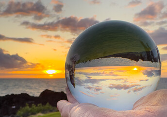 SUNSET THROUGH LENSE BALL ON BIG ISALND HAWAII