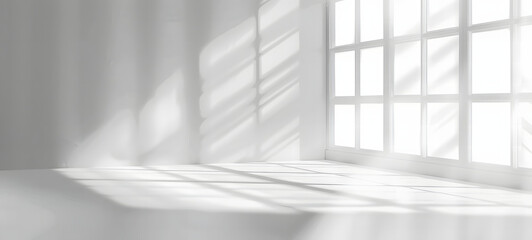 Fototapeta premium A serene and minimalist image capturing the play of light and shadows on a white wall through a large window, invoking calmness and purity. 3d render of white empty room with window and sunlight on it