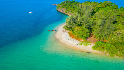 Beautiful sandy beach and long-tail boats of Japan island in Andaman Sea, Ranong Province, Southern...