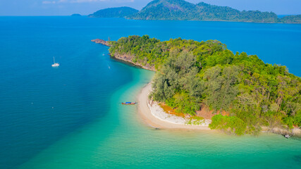 Beautiful sandy beach and long-tail boats of Japan island in Andaman Sea, Ranong Province, Southern Thailand, Asia.