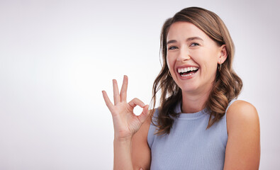 Okay, agreement and portrait of happy woman in studio mockup with positive attitude. Thank you,...