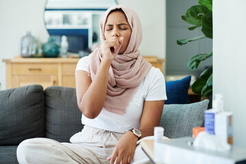 Muslim, woman and sick or cough on sofa in living room with illness, flu and tired at home. Female person, lounge and fever with medication to relax, chill and calm on couch for recovery or rest