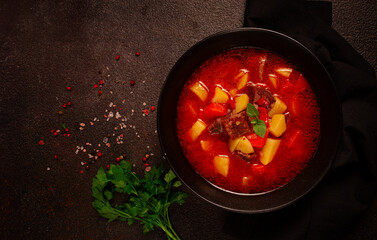 meat goulash, with potatoes and carrots, sweet pepper, traditional Hungarian soup, homemade, no...
