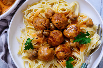 Chicken meatballs beef stroganoff with pasta.top veiw