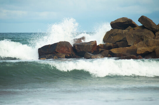 waves breaking on rocks