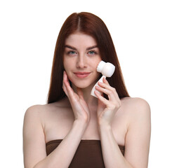 Washing face. Young woman with cleansing brush on white background