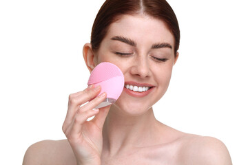 Washing face. Young woman with cleansing brush on white background