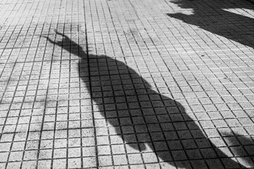 Horned Hat Shadow Cast on Ground During Halloween
