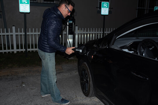 Man charging EV