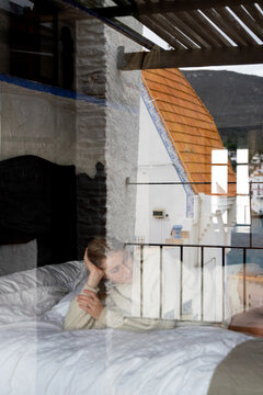 Woman Lying On Bed
