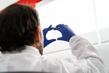  Close-up hands of scientist at laboratory