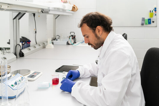  scientist researcher working on biotech laboratory