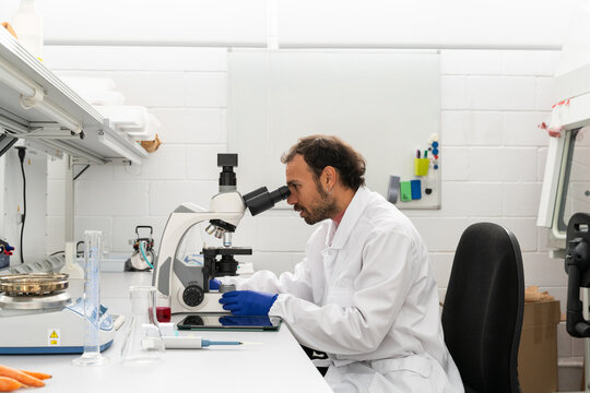  scientist researcher working on biotech laboratory