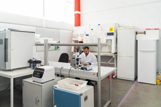  scientist researcher working on biotech laboratory