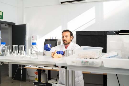  scientist researcher working on biotech laboratory