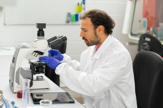  scientist researcher working on biotech laboratory
