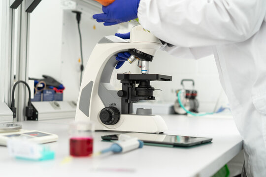  scientist researcher working on biotech laboratory
