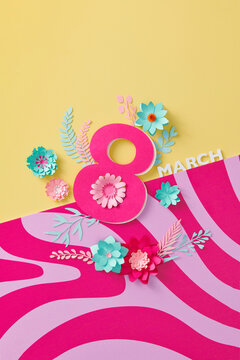 Number 8 with paper flowers on bright color background.
