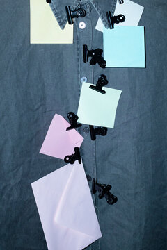 Contemporary formal office shirt with paper clips and Post-it notes