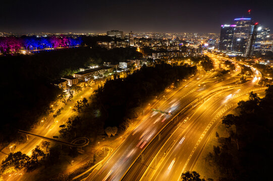 An aerial view of traffic leading to downtown Perth city at night