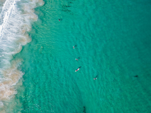Top down view of surfers in beautiful clear waters