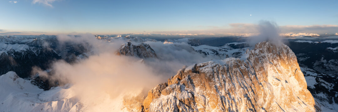 Sassolungo Mountains in the clouds Sella pass Italian Dolomites