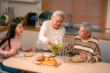 Asian Family Happiness in the Kitchen: Senior Parents Cooking Dinner with Joy, Children Laughing, A Fun and Loving Atmosphere of Togetherness, Creating Delicious Meals and Beautiful Memories