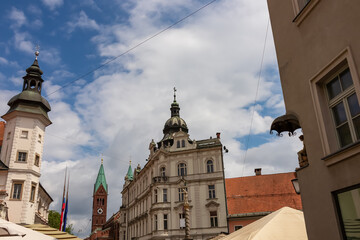 Vibrant atmosphere of street cafes on Grajski Trg or Castle Square. View of Maribor Castle and...