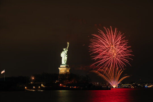 Fireworks near The Statue Of Liberty In New York City
