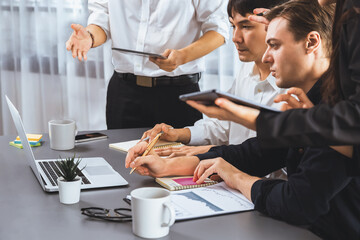Data analysts team of office worker collaborate on business intelligence BI dashboard to analyze...