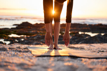 Hands, legs and sunshine with beach yoga, fitness and outdoor with lens flare and ocean for calm and zen. Yogi person, exercise or workout on shore, pilates and energy with stretching for self care
