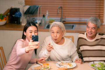 Asian Family Happiness in the Kitchen: Senior Parents Cooking Dinner with Joy, Children Laughing, A Fun and Loving Atmosphere of Togetherness, Creating Delicious Meals and Beautiful Memories