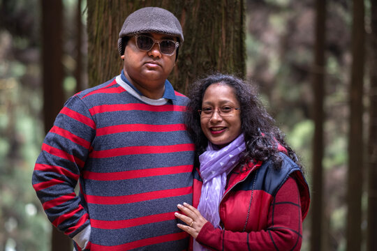 Indian couple wearing woolen dress posing in front of camera