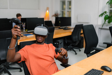 A man in a VR headset in the office
