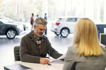 Contract completion joyful client signing agreement anonymous dealer