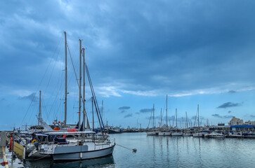 Fototapeta premium yachts and ships in the port in Limassol Cyprus in spring cloudy