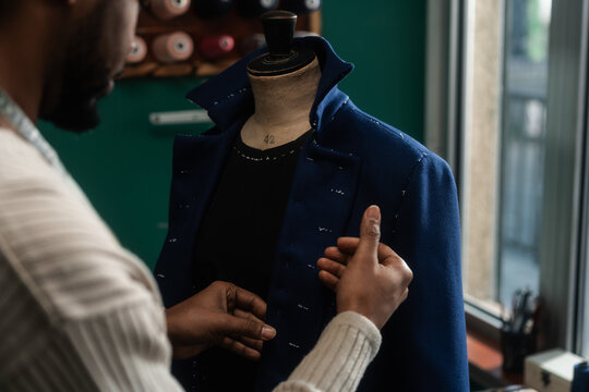 Anonymous Male Tailor Working On The Coat In His Workshop - Powered by Adobe
