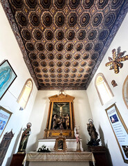 Tunja, Boyacá, Colombia - December 27, 2023: Ceiling decoration and one of the altars of the...