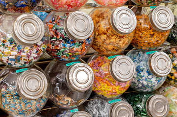 Exhibition of candies in glass jars