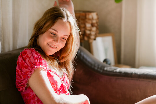 Teen resting on sofa