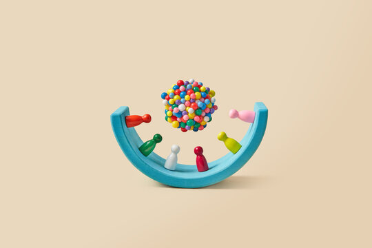 Colorful game pawns on wooden arch under sphere made of small balls