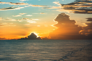 Beautiful, golden sunset sky over the calm Atlantic Ocean. 