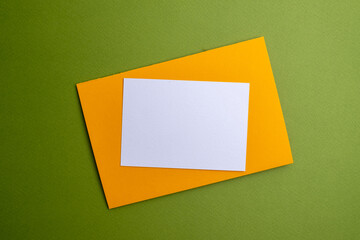 Сolored envelopes and notepads on a yellow background. Space for text and logo. Mockup. Brainstorming and concept of idea, inspiration and creative ideas