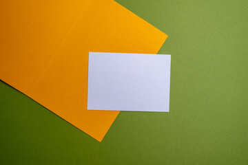 Сolored envelopes and notepads on a yellow background. Space for text and logo. Mockup. Brainstorming and concept of idea, inspiration and creative ideas
